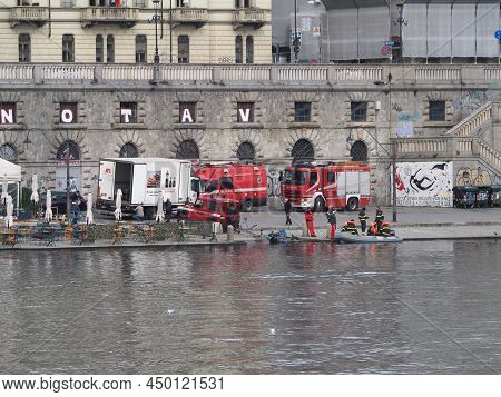 Firefighters On The Banks Of River Po In Turin
