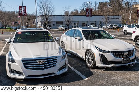 Monroeville, Pennsylvania, Usa February 27, 2022 Two Used White Cadillac Sedans Together On A Used C