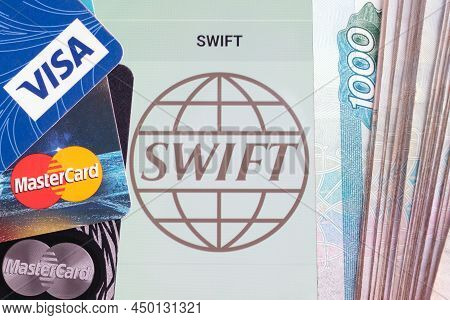 Moscow, Russia - February 28, 2022: Top View Of Bank Cards With Logos Of Visa And Mastercard And Rus