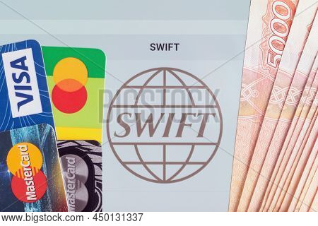 Moscow, Russia - February 28, 2022. Top View Of Bank Cards With Logos Of Visa And Mastercard And Rus