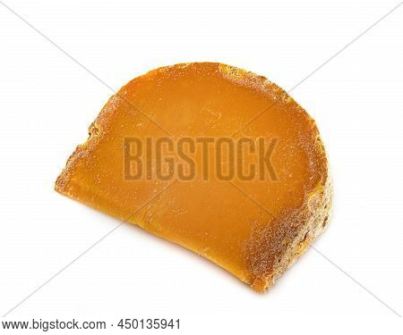 Extra-old Mimolette In Front Of White Background