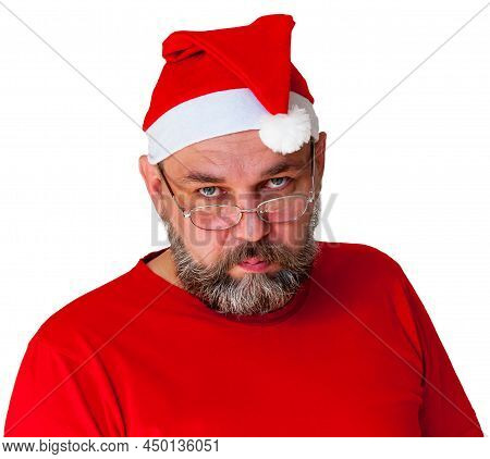 Unusual Santa Claus Isolated On White. Serious Santa Claus Is Looking At Us. Middle-aged Man As Sant
