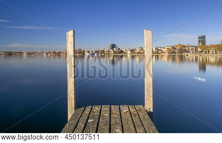 Zug, Switzerland - December 31, 2021: View On The Town Zug By The Lake In Switzerland With Foregroun