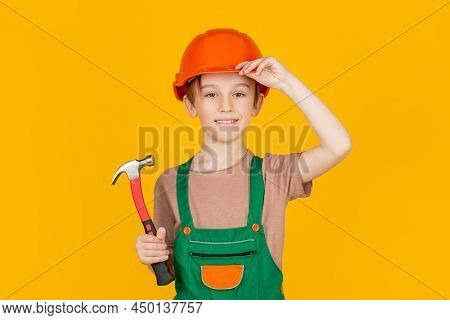 Child Building Helmet, Hard Hat. Hammer Hammering. Little Builder In Helmet And Hummer. Child Dresse