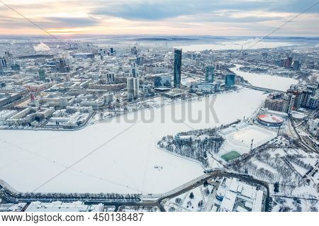 Yekaterinburg Aerial Panoramic View In Winter At Sunset. Yekaterinburg City And Pond In Winter. Yeka