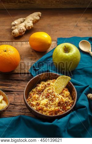 Couscous Masfouf With Dried Fruits And Nuts In A Plate On A Blue Napkin Next To A Spoon On The Table