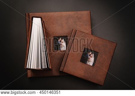 Wedding Photobooks In Brown Leather Binding With Photos On The Cover