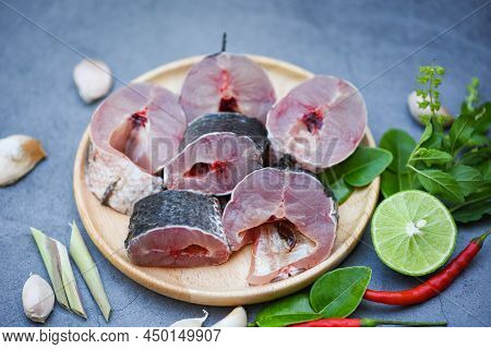 Snakehead Fish For Cooking Food, Striped Snakehead Fish Chopped With Ingredients Lemon On Wooden Pla
