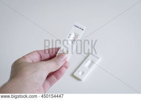 Human Holding Covid-19 Rtk Antigen Rapid Test Result. Screening Method For Covid-19.