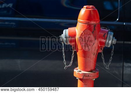 Side; Turkey - February 13 2022: Close-up - Overhead Red Pressurized Fire Hydrant Against Car