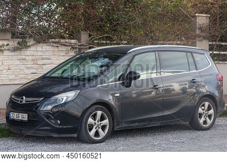 Side, Turkey - February 13 2022:  Gray Opel Zafira   Is Parked  On The Street On A Warm Summer Day A