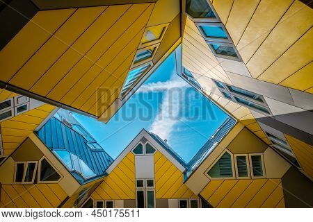 ROTTERDAM, NETHERLANDS - MAY 11, 2017: Cube houses - innovative cube-shaped houses designed by architect Piet Blom with idea to optimize space in Rotterdam, Netherlands now became a tourist attraction