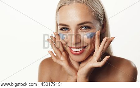 Skin Care And Cosmetology. Portrait Of Woman With Clean Glowing Skin, Applying Clay Mask, Daily Care