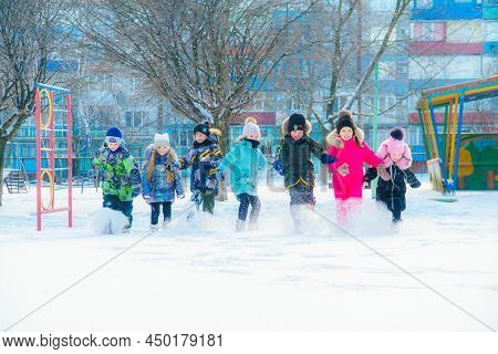 Alchevsk, Ukraine - January 26, 2022: Kindergarten Children On A Winter Walk