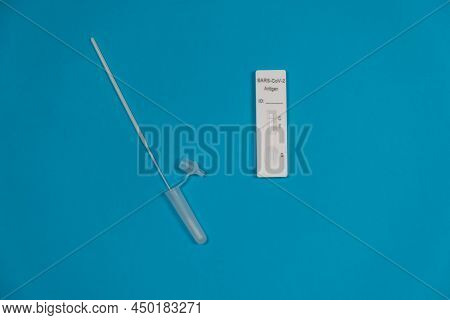 Antigen Testing Kit. Negative Sars-cov-2 Rapid Antigen Test Isolated On Blue Background With Nasal S