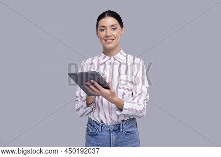 Girl Using Tablet Standing Looking To Camera Isolated. Commecial, Shopping, Advertisment, Technology
