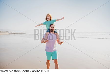 Little Boy Kid With Daddy Carrying Him On Shoulders. Dad And Child Walk Together. Family Travel, Vac