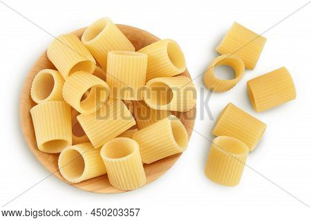 Raw Italian Pasta In Wooden Bowl Isolated On White Background With Clipping Path . Mezze Maniche Rig