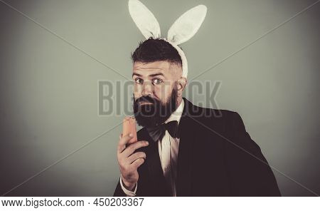 Funny Bunny Man On Easter Day. Happy Easter And Holiday. Nibbles A Carrot Like A Hare. Spring Holida