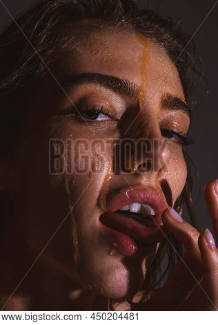 Portrait Of Sexy Woman Girl With A Honey Facialmask Closeup. Beautiful Woman With Honey On Her Face.