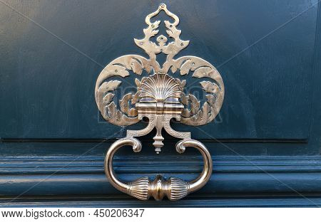 European Vintage Old Metal Wrought Iron Door Knocker. Design Detail. Paris.