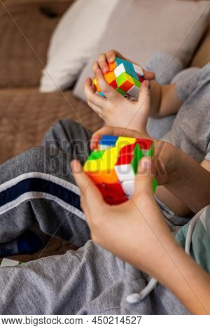 Closeup Hands Smart Babies Assembling Rubiks Cube 3x3 Enjoying Early Development Game At Home