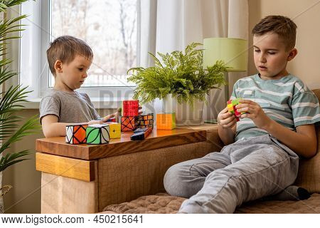 Two Male Kids Brothers Assembling Rubiks Cube Thinking Solving Logic Decision