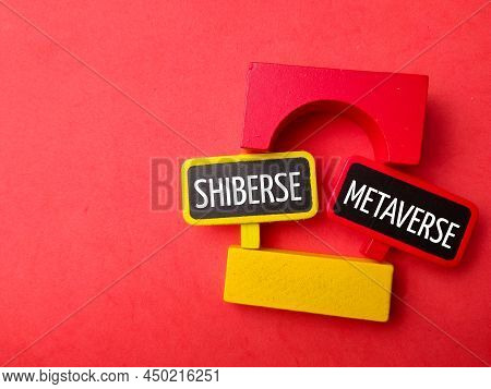 Top View Colored Block And Wooden Board With Text Shiberse Metaverse On Red Background.