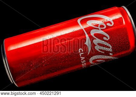 Coca-cola 330ml Aluminum Can With Water Droplets On A Black Background. A Classic Sweet Drink For Al