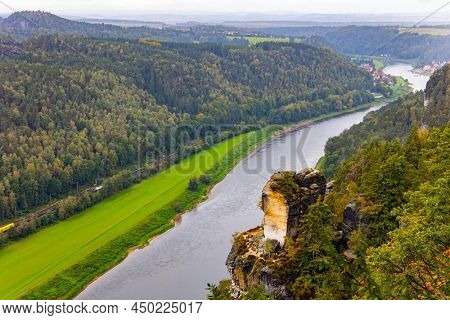 The magnificent German river Elbe. Germany. The sandy cliffs of Bastei, 200 meters high above the Elbe River, are a famous tourist attraction. Artists' road Malerweg in Saxon Switzerland.