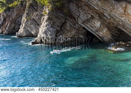 Petrovac, Montenegro, 29. August 2021: Boat At Sea With Tourists Near The Clifs In Town Petrovac, Mo