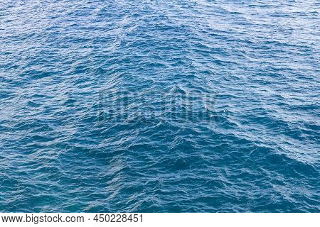Blue Water Surface With Small Waves At Sea