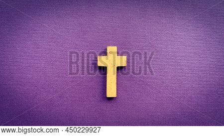 Cross On Purple Color Cover. Christianity Concept