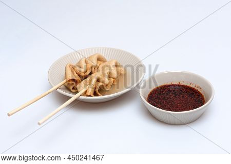 Fish Cake Skewers In A Bowl On A White Background