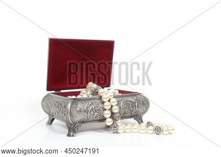 Jewelry Box With Pearl Necklace On Light Colored Background