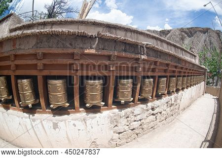 Ladakh , India- May 15,2019 : A Tibetan Prayer Using Brass As A Revolving Instrument To Alchi Monast
