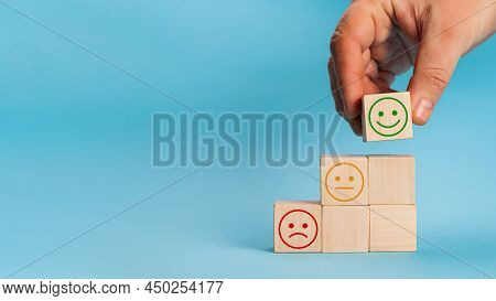 Hand Chooses Smiley Face Growth On Wood Block Cube, The Best Exc