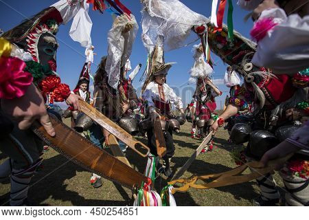 Elin Pelin, Bulgaria - February 26, 2022: Masquerade Festival In Elin Pelin, Bulgaria. People With M