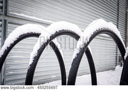 A Modern Bike Rack Covered In Snow At A Downtown Work Place In Calgary Alberta Canada.