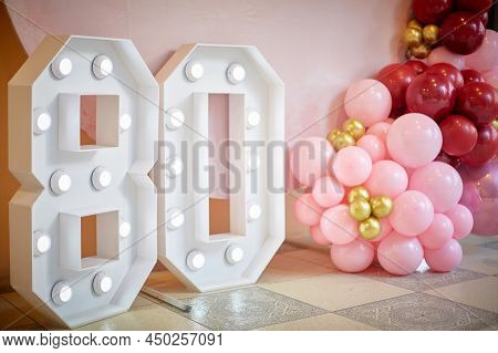 Decoration Of The Festive Photo Zone At The Birthday Party. Figure 80 And Aerodesign Of Balloons