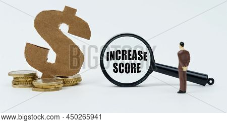 Economy And Finance Concept. On A White Background, Coins, A Dollar Symbol And A Figure Of A Busines