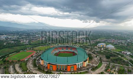 Aerial View Of The Largest Stadium Of Pakansari Bogor From Drone And Noise Cloud. Bogor, Indonesia,