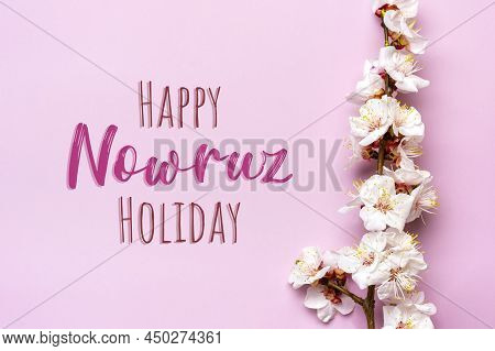 Sprigs Of The Apricot Tree With Flowers On Pink Background Text Happy Nowruz Holiday Concept Of Spri