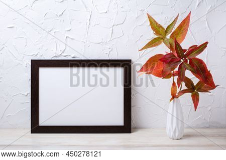 Black Landscape Frame Mockup With  Red Green Grass In The Vase