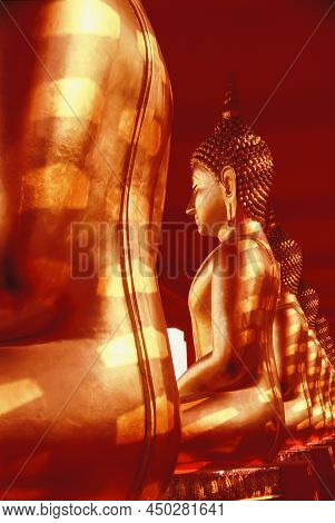 Golden Buddha Images Sculpture At An Ancient Temple In Thailand. Abstract Striped Shadow With Sunlig