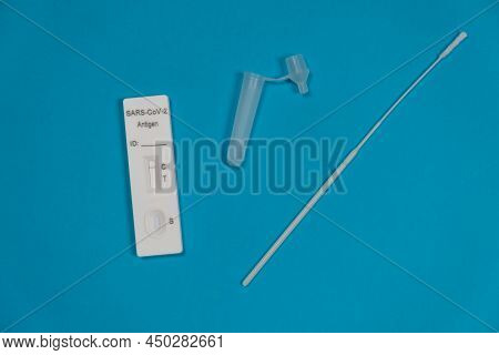 Antigen Testing Kit. Negative Sars-cov-2 Rapid Antigen Test Isolated On Blue Background With Nasal S