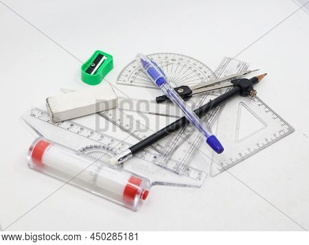 Geometrical Sketching Tools Like Protractor, Set Square, Ruler, Pen, Pencil, Sharpener, Compass And 