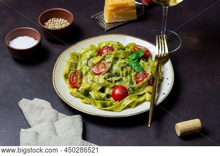 Linguini Pasta With Pesto Sauce, Tomatoes And Cheese. Healthy Eating. Vegetarian Food. Italian Cuisi
