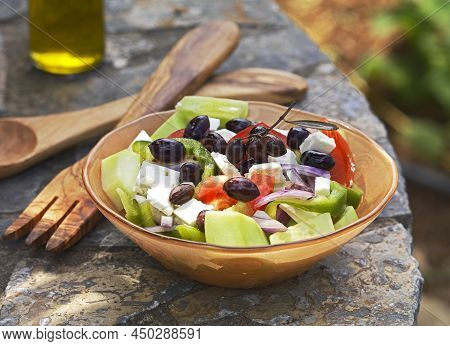 A Typical Greek Salad Made Of Fresh Ingredients,tomato,cucumber, Pepper,onion, Feta Cheese,olives.gr