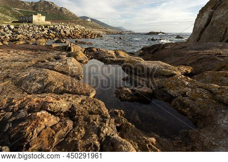 Silleiro Cape And Old And New Lighthouses At Sunset In Ponteverdra, Galicia, Spain